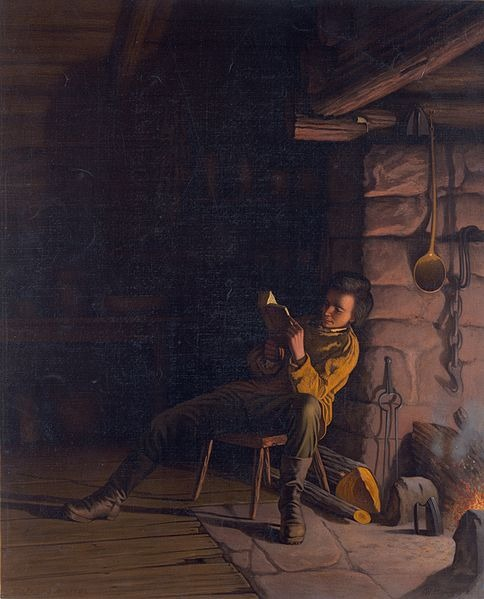 Boy Lincoln reading by firelight resized 600