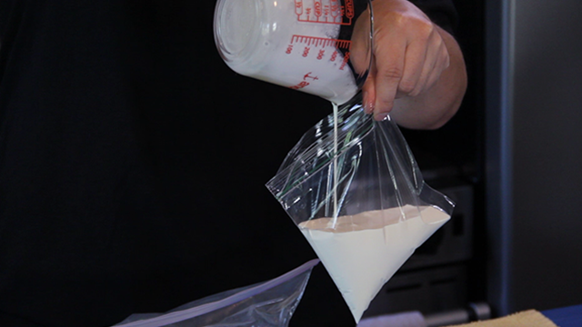 Pour your cream mixture into the plastic bag.