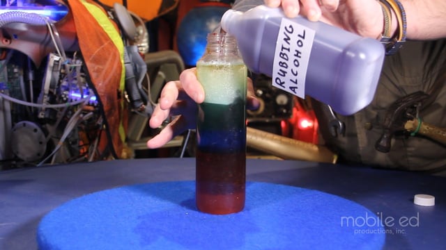 And now, the rubbing alcohol.  Look how it goes below the oil!