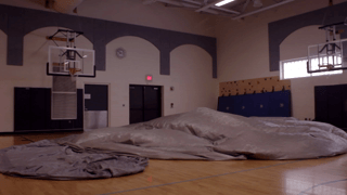 Watch the SkyDome Planetarium inflate inside your school's gym